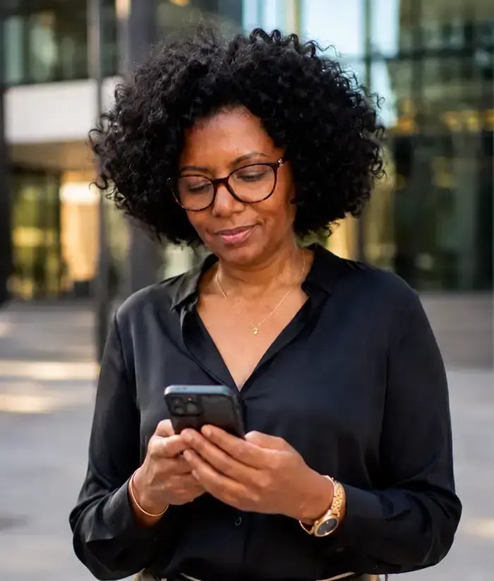 Woman looking down at phone